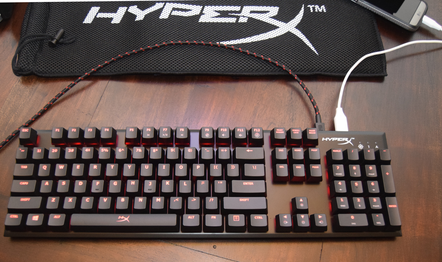 HyperX Alloy FPS Mechanical Gaming Keyboard review in use while charging phone and lit